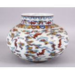 A CHINESE WUCAI DECORATED PORCELAIN JAR - decorated with bats amongst stylized clouds, with ruyi