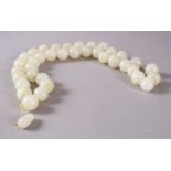 A GOOD SET OF CHINESE CARVED WHITE JADE BEAD NECKLACE, comprising 37 carved beads and a toggle,