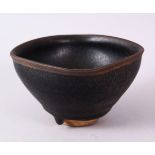 A CHINESE JIANWARE TEA BOWL, with dark brown drip glazed decoration, 11cm diameter.