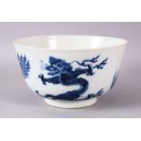 A CHINESE BLUE AND WHITE PORCELAIN BOWL, painted with phoenix and dragons, the base with Kangxi