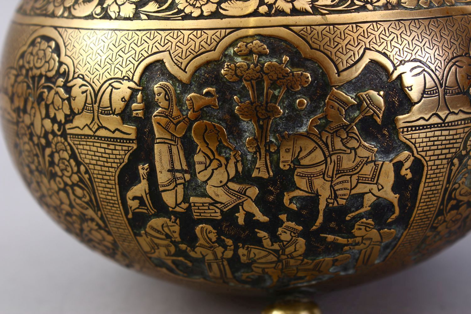 A GOOD ISLAMIC BRASS TRIPLE FOOT CALLIGRAPHIC BOWL, with panels of figures and bands of calligraphy, - Image 9 of 9