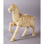 A LARGE 19TH / 20TH CENTURY CHINESE CARVED SECTIONAL BONE FIGURE OF A TANG STYLE HORSE, stood in a