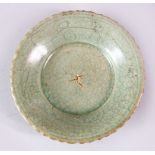 A RARE CHINESE MING CIRCULAR CELEDON DISH, with crackle glaze, 11cm diameter.