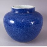 A 19TH CENTURY CHINESE POTTERY BULBOUS VASE, decorated with a mottled blue glaze, 21cm high.