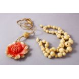 TWO CHINESE 19TH CENTURY CARVED IVORY ITEMS, One necklace carved and stained in floral style, with a