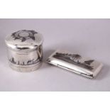 AN IRAQI SILVER AND NIELLO CIRCULAR BOX AND COVER, together with a similar small hinged box, 5.5cm