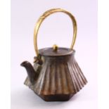 A FINE JAPANESE EDO / MEIJI PERIOD IRON KETTLE & COVER, the kettle with a bronze moulded handle of