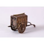 A 19TH CENTURY JAPANESE GILT SILVER SALT SHAKER in the form of a rickshaw, with moulded decoration