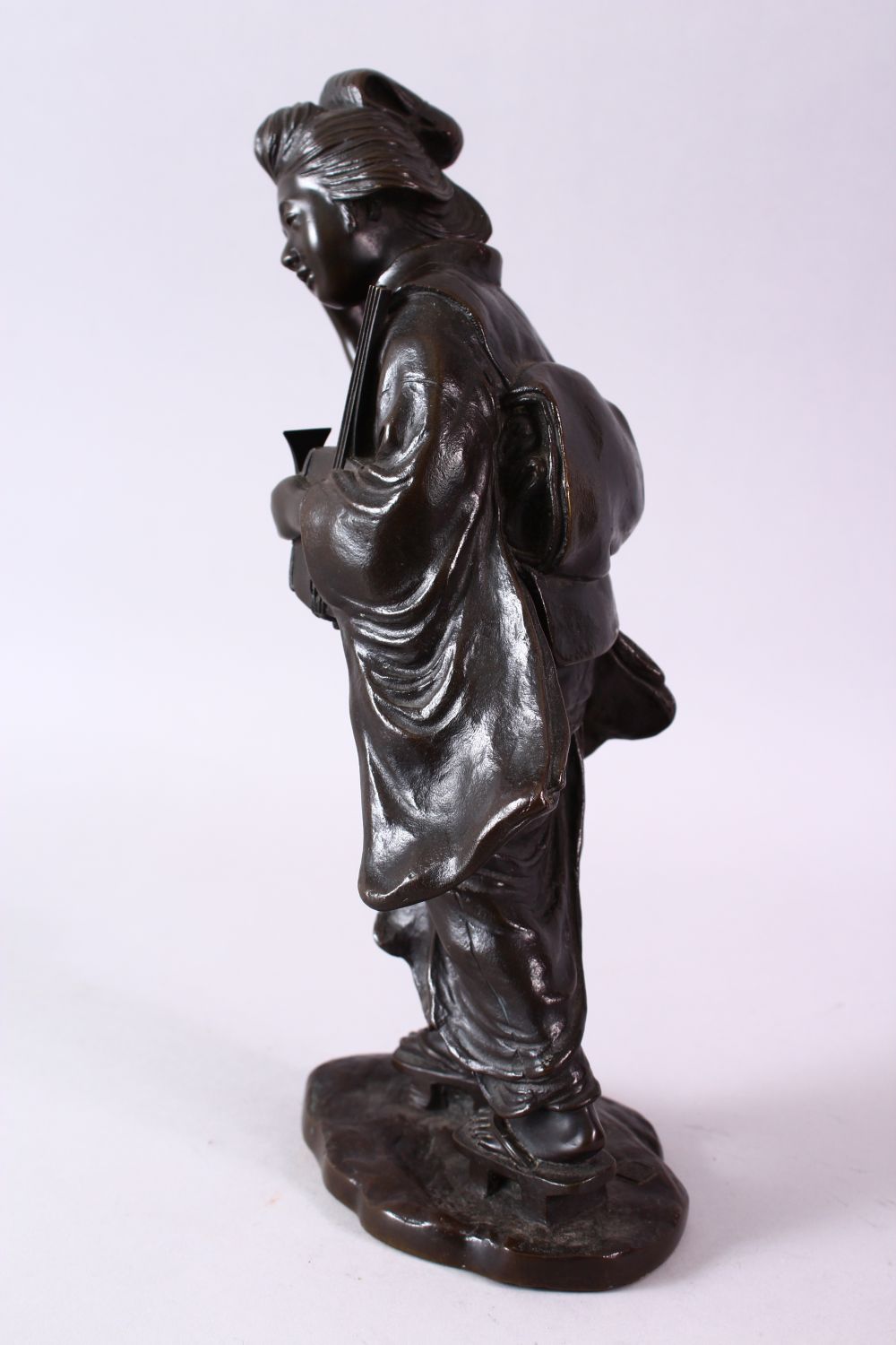 A 19TH CENTURY JAPANESE BRONZE FIGURE OF A GIRL HOLDING A MUSICAL INSTRUMENT, 32cm high. - Image 6 of 9