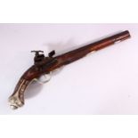 AN 18TH CENTURY INDIAN FLINTLOCK PISTOL, with gold inlaid barrel, carved stone, profusely inlaid