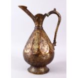 A SELJUK STYLE BRONZE EWER, with panels of engraved calligraphy, 35cm high.