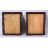A PAIR OF 19TH CENTURY CHINESE CARVED WOOD PICTURE FRAMES, carved with prunus and scroll decoration,