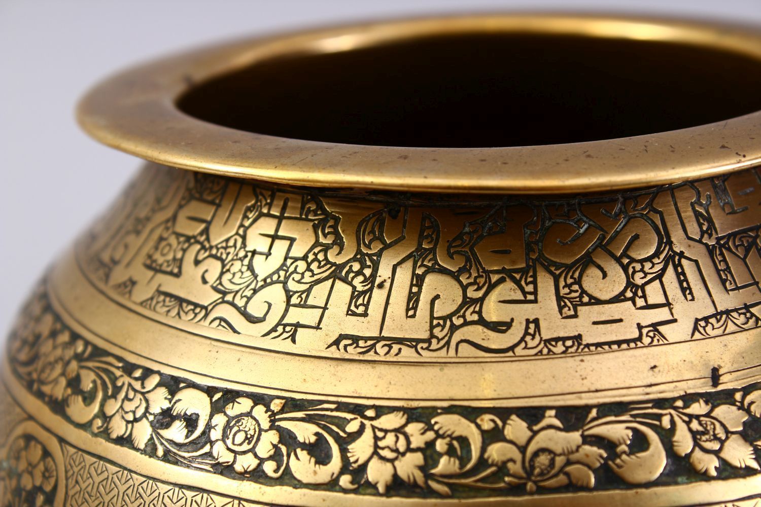 A GOOD ISLAMIC BRASS TRIPLE FOOT CALLIGRAPHIC BOWL, with panels of figures and bands of calligraphy, - Image 6 of 9