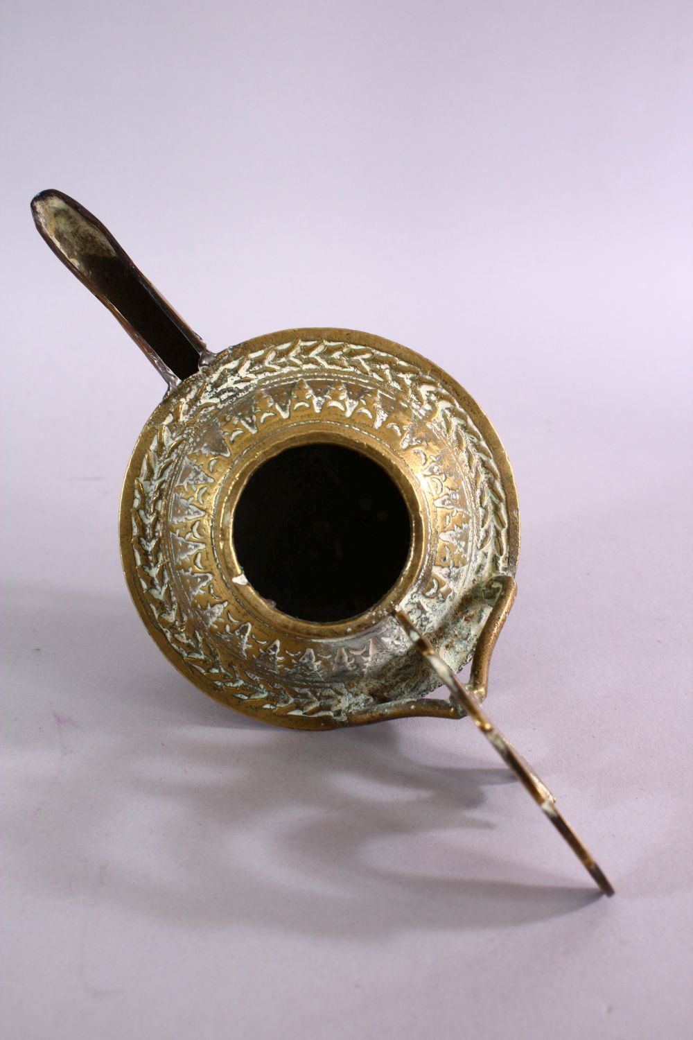 AN UNUSUAL EARLY ISLAMIC POSSIBLY ANDALUSIAN SPANISH BRASS OIL LAMP, with moulded decoration, 17cm - Image 5 of 6