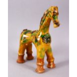 A GOOD TURKISH CANNAKKALE POTTERY FIGURE OF A HORSE - OIL POURER, modeled as a stylized horse,