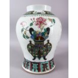 A CHINESE FAMILLE ROSE PORCELAIN GINGER JAR / VASE, decorated with a display of native flora, with