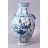 A CHINESE YUAN STYLE BLUE & WHITE TWIN HANDLE PORCELAIN VASE, decorated with scenes of cranes