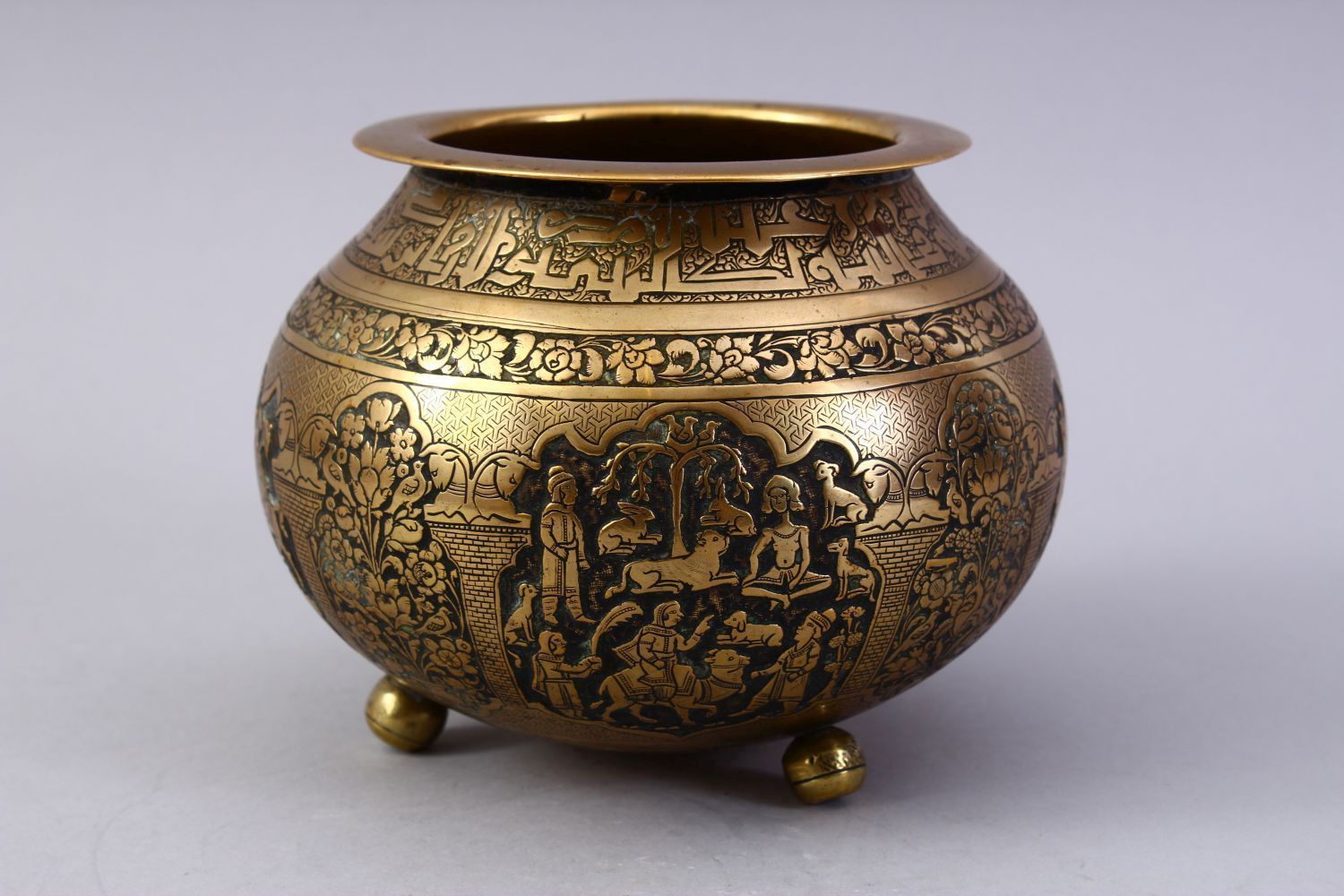 A GOOD ISLAMIC BRASS TRIPLE FOOT CALLIGRAPHIC BOWL, with panels of figures and bands of calligraphy, - Image 4 of 9