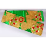 A FINE JAPANESE SILK EMBROIDERED FUKURO OBI TIE - upon a green ground with gold, green, white &