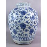 A CHINESE MING DYNASTY BLUE & WHITE PORCELAIN JAR / VASE, decorated with scrolling lotus decoration,