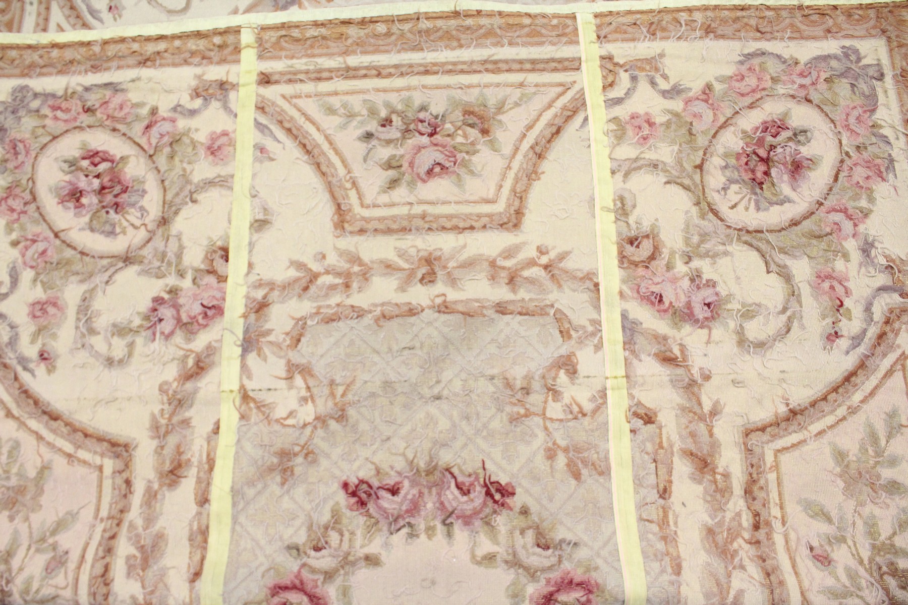 AN AUBUSSON STYLE TAPESTRY WALL HANGING, beige ground decorated with floral panels. 9ft 0ins x 6ft - Image 5 of 5