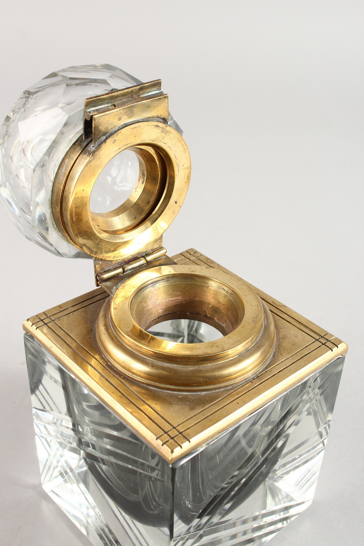 A VERY HEAVY CUT GLASS AND BRASS TABLE INKSTAND with hinged top. 3.75ins square. - Image 2 of 4