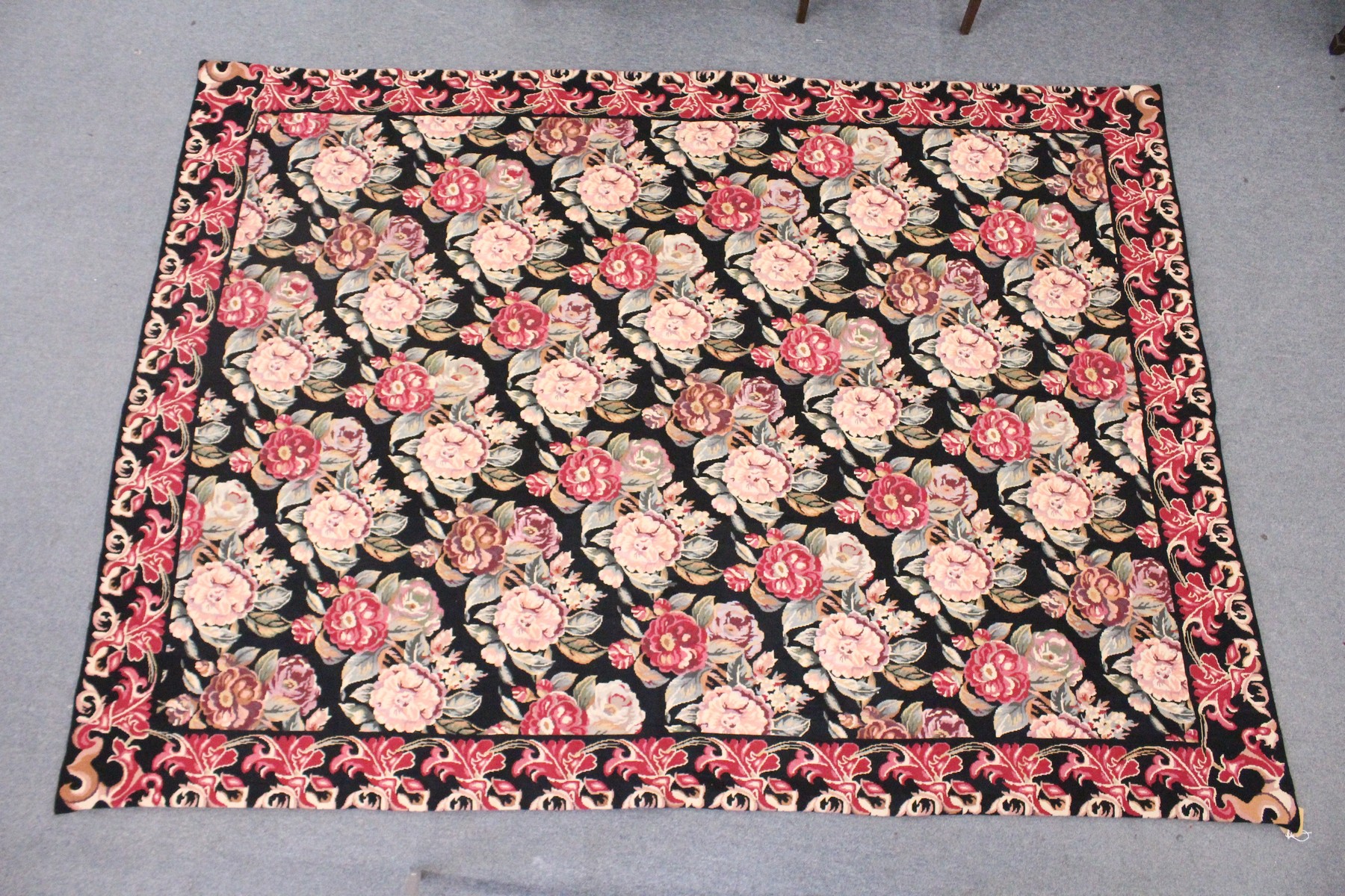 A LARGE AUBUSSON STYLE WOOLWORK TAPESTRY WALL HANGING, black ground with all-over floral decoration. - Image 8 of 8