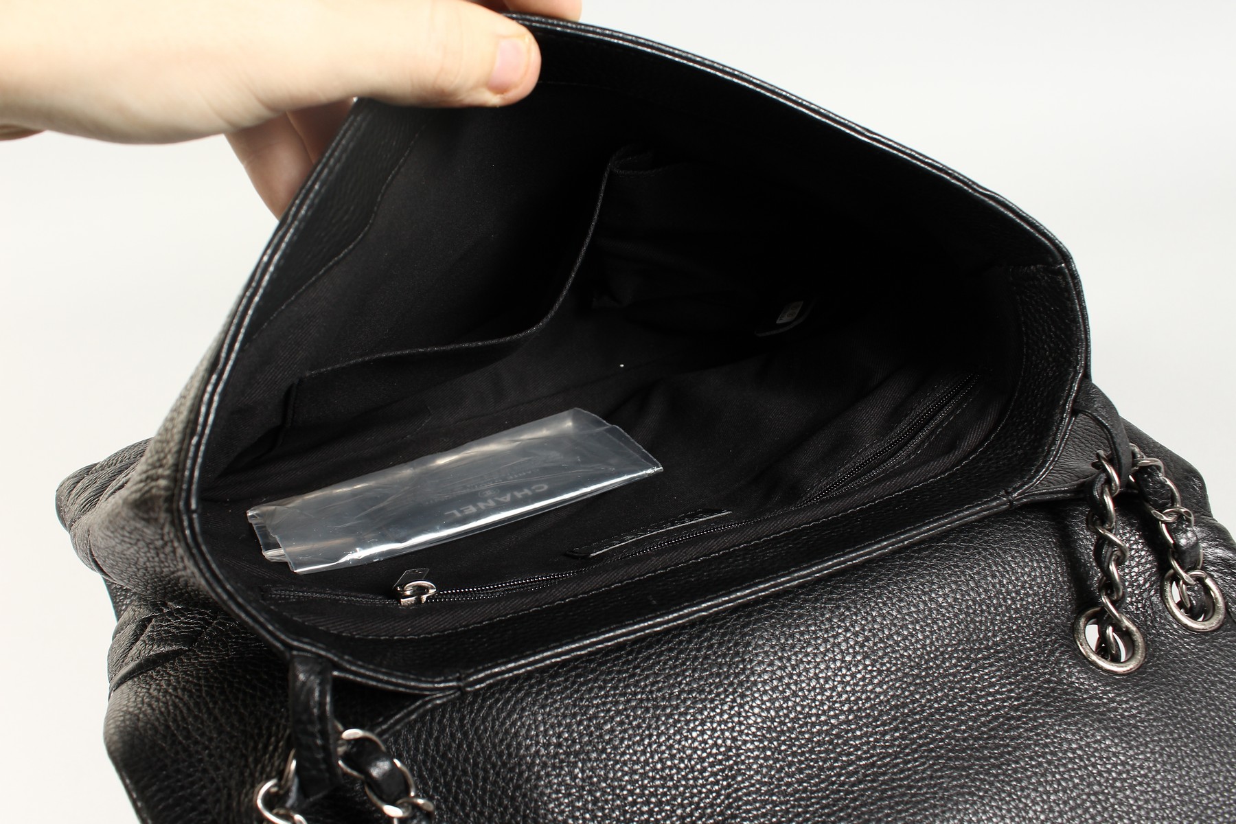 A CHANEL FOLD-UP QUILTED HANDBAG in a Chanel bag. - Image 6 of 11