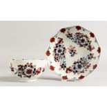 A RARE 18TH CENTURY LIVERPOOL TEA BOWL AND SAUCER painted in Imari style with moulded rim.