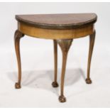A GEORGIAN STYLE WALNUT HALF MOON CARD TABLE, with green baize, on cabriole legs ending in claw