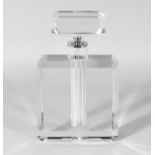 A CHANEL STYLE RECTANGULAR SCENT BOTTLE AND STOPPER. 10ins high.