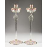 A GOOD PAIR OF VENETIAN ENAMEL DECORATED GLASS CANDLESTICKS. 13ins high.