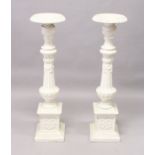 A GOOD PAIR OF VICTORIAN WHITE PAINTED CAST IRON STANDS, fluted columns on pedestal bases. 3ft