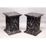 A LARGE PAIR OF PAINTED FAUX MARBLE PEDESTALS. 2ft 5ins high x 1ft 9ins square.