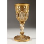 A BOHEMIAN GILDED GOBLET. 7.5ins high.