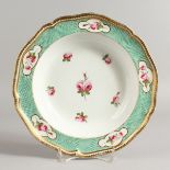 AN EARLY 19TH CENTURY DERBY SOUP PLATE painted with five roses around a central rose, under a raised