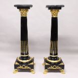 A VERY GOOD PAIR OF LARGE BLACK MARBLE AND ORMOLU COLUMNS with square tops. 4ft 5ins high.