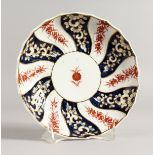 AN 18TH CENTURY CHELSEA DERBY SAUCER SHAPED DISH painted with a version of the Queen Charlotte