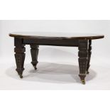 A LARGE MAHOGANY WIND-OUT DINING TABLE, with bow end leaves, on carved tapering legs with castors.