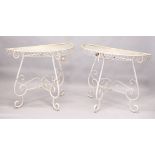 A GOOD PAIR OF WHITE PAINTED WIREWORK DEMILUNE TABLES. 2ft 10ins high x 3ft 5ins wide.