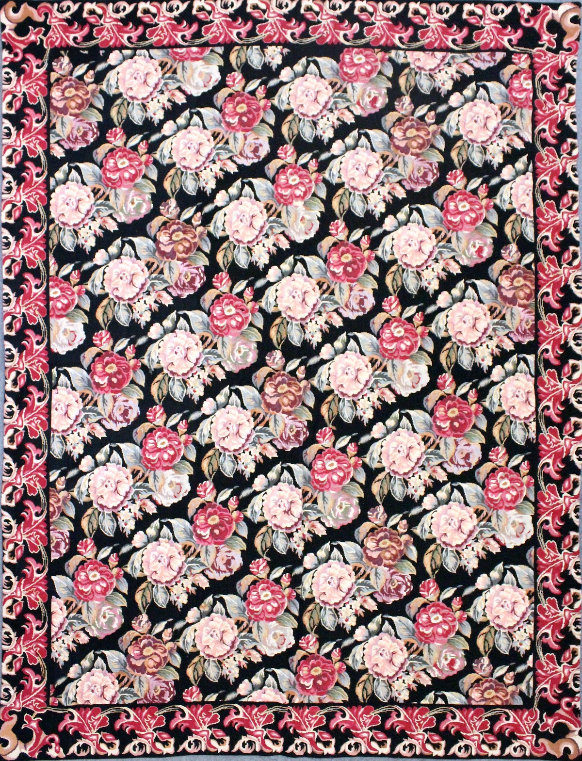 A LARGE AUBUSSON STYLE WOOLWORK TAPESTRY WALL HANGING, black ground with all-over floral decoration.