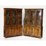 A PAIR OF GEORGIAN STYLE MAHOGANY STANDING BOOKCASES, the top with three glazed doors over three