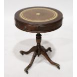 A GEORGIAN STYLE MAHOGANY CIRCULAR DRUM TABLE with leather top, on four legs. 1ft 8ins diameter.