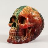 A LARGE RESIN SKULL. 8ins high.