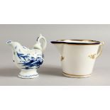 AN 18TH CENTURY DERBY BLUE AND WHITE EWER painted with a Chinese landscape and a Derby cream jug