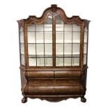 A GOOD LATE 18TH CENTURY DUTCH FIGURED WALNUT VITRINE, with shaped top, two glazed doors enclosing