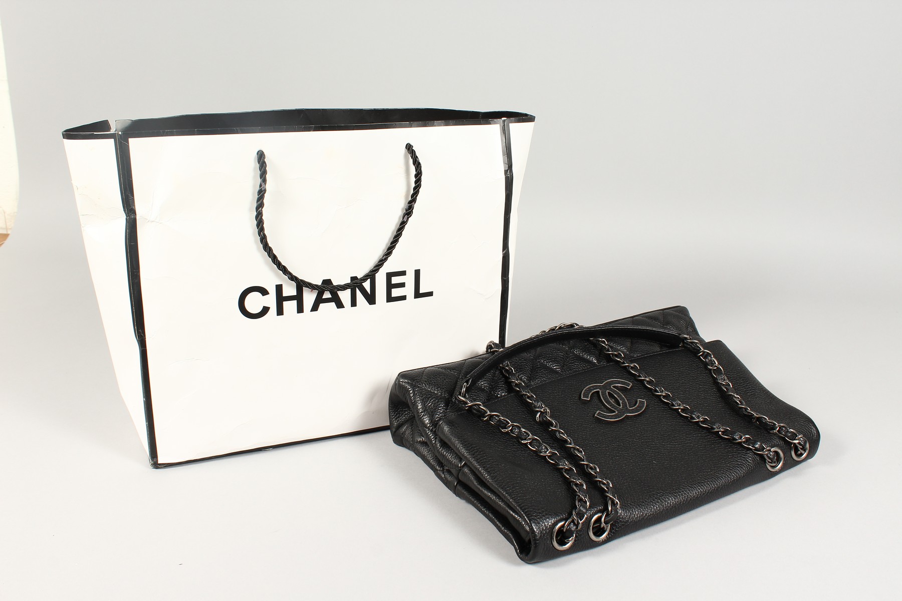 A CHANEL FOLD-UP QUILTED HANDBAG in a Chanel bag. - Image 11 of 11