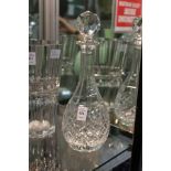 A cut glass decanter.