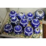 A quantity of Chinese blue and white prunus pattern ginger jars and covers.