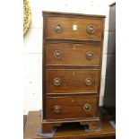 A mahogany small narrow four drawer chest.